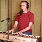 Aaron Clift playing keyboard at progstock