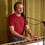 Aaron Clift playing keyboard at progstock