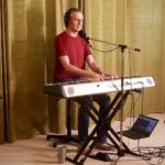 Aaron Clift playing keyboard at progstock