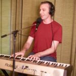 Aaron Clift playing keyboard at progstock