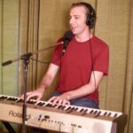 Aaron Clift playing keyboard at progstock